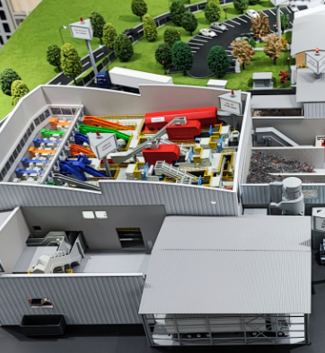 Ein hochpräzises Industriemodell, entwickelt von ARI Modellbau, das ein detailliertes Fabriklayout mit Maschinen, Produktionslinien und Infrastrukturkomponenten zeigt. Dieses Modell wird für Fabrikplanung, technische Simulationen und Produktprototypi