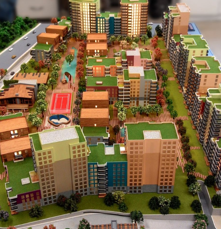 Ein professionell gefertigtes und detailreiches Architekturmodell von ARI Modellbau, erstellt für einen Bau- und Infrastrukturaussteller auf der INTERMAT. Das Modell zeigt Straßenverläufe, Baupläne, Lagepläne und Gebäudefassaden im hochauflösenden Mi